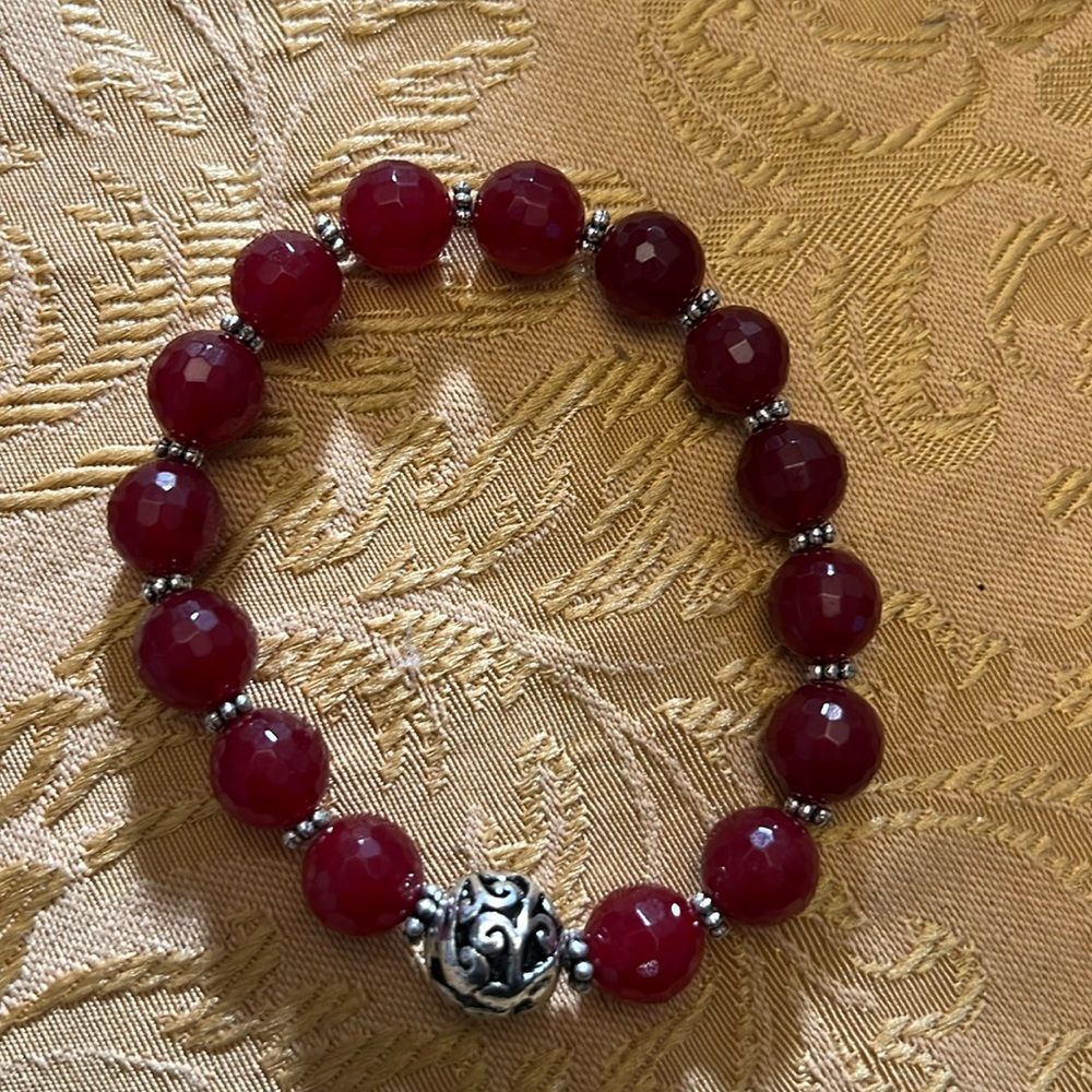 Handcrafted beaded bracelet with metal bead detail